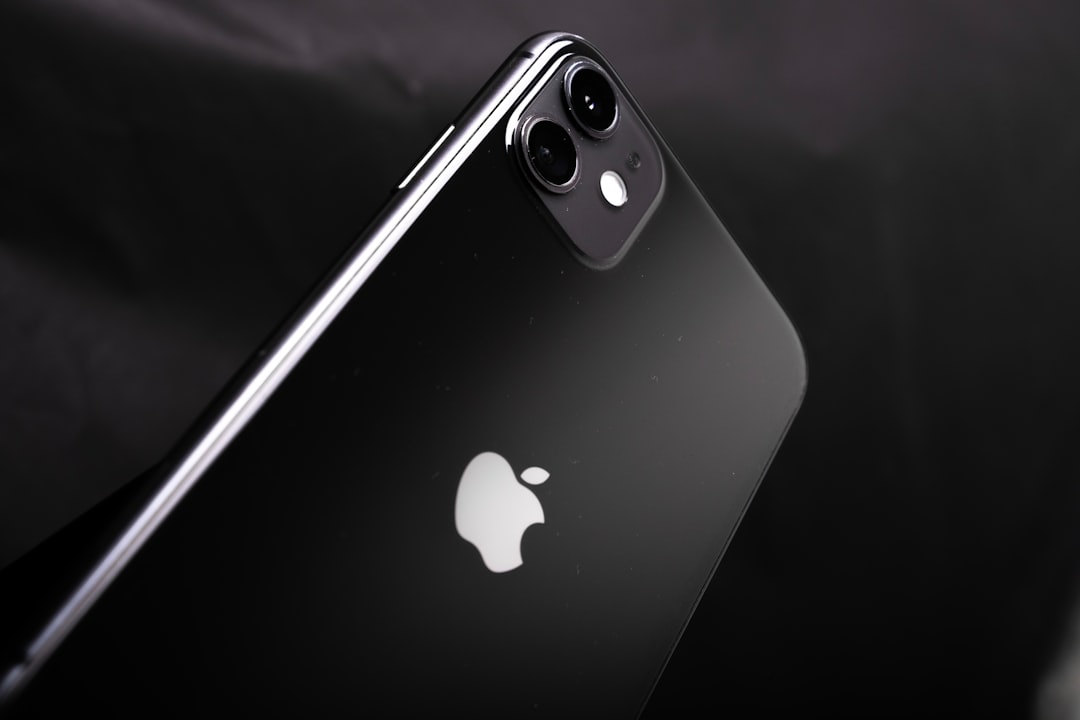 Discover the elegance of the iPhone 11, beautifully showcased in a professional studio setting with a striking black backgrou