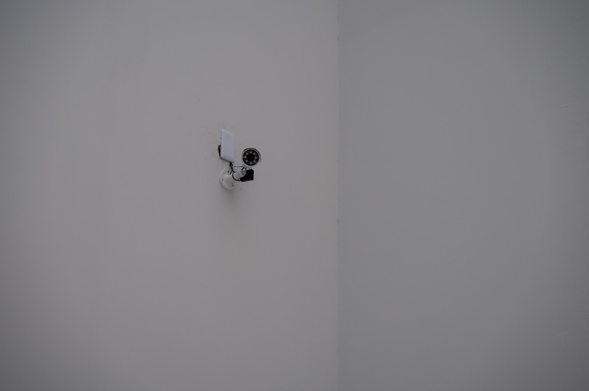 Security surveillance camera representing NSA rule-breaking in AI deployment oversight