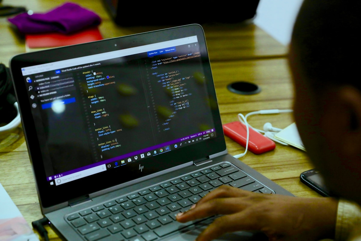 Developer coding on laptop representing Alibaba Qwen 27B AI model coding performance