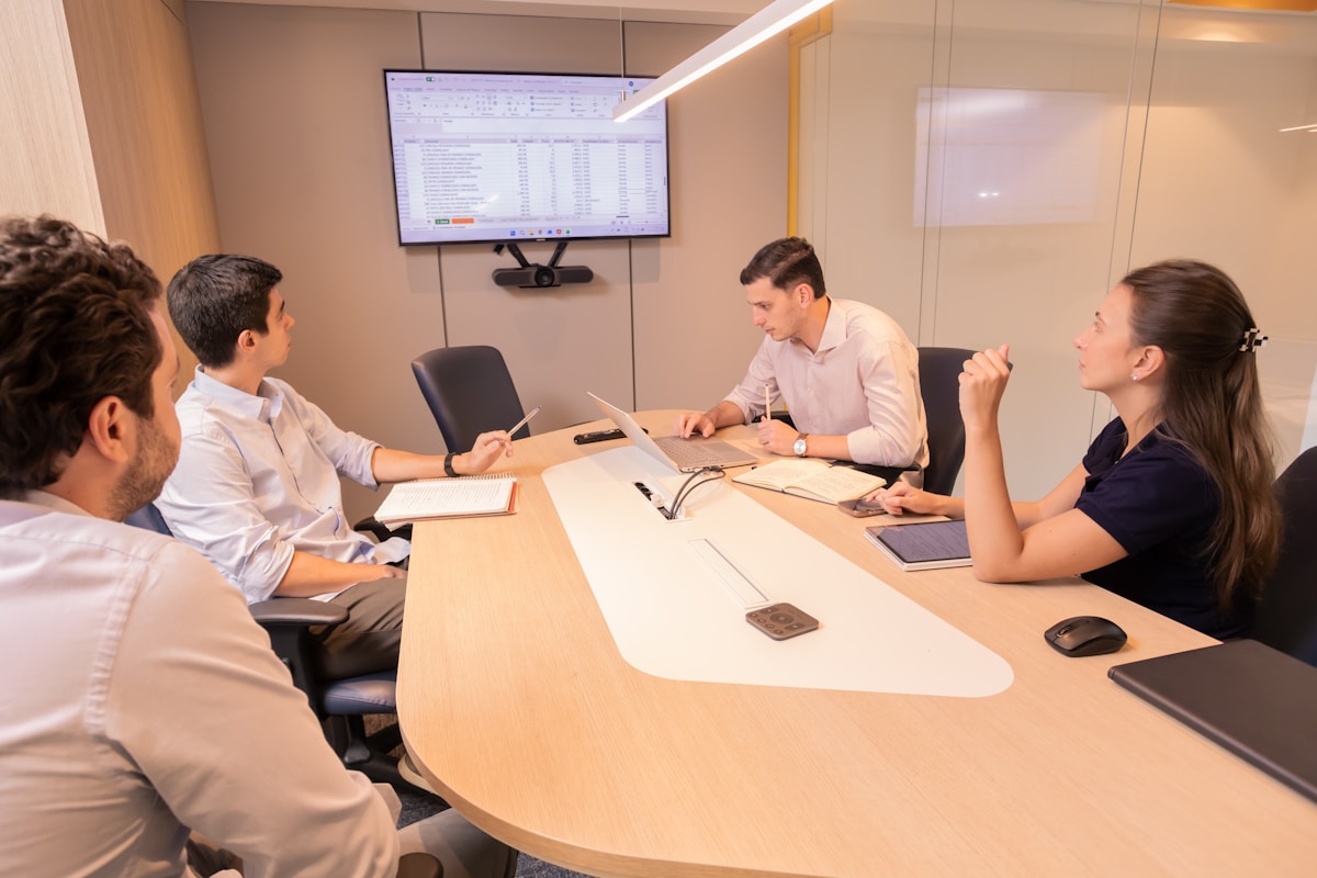 AI company executives in corporate boardroom discussing public relations and AI ethics